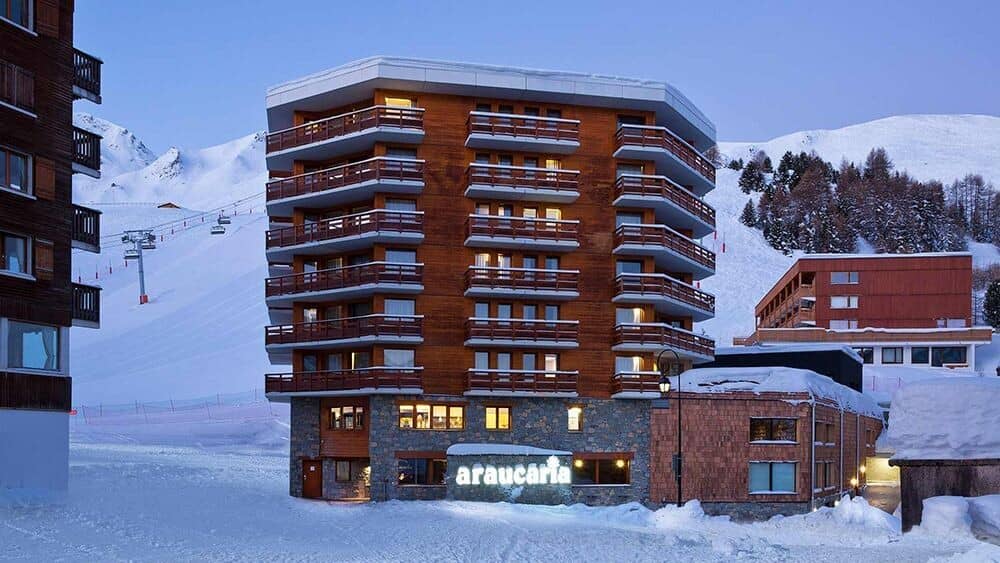 Ski-in/ski-out chalet exterior with private balconies and mountain views