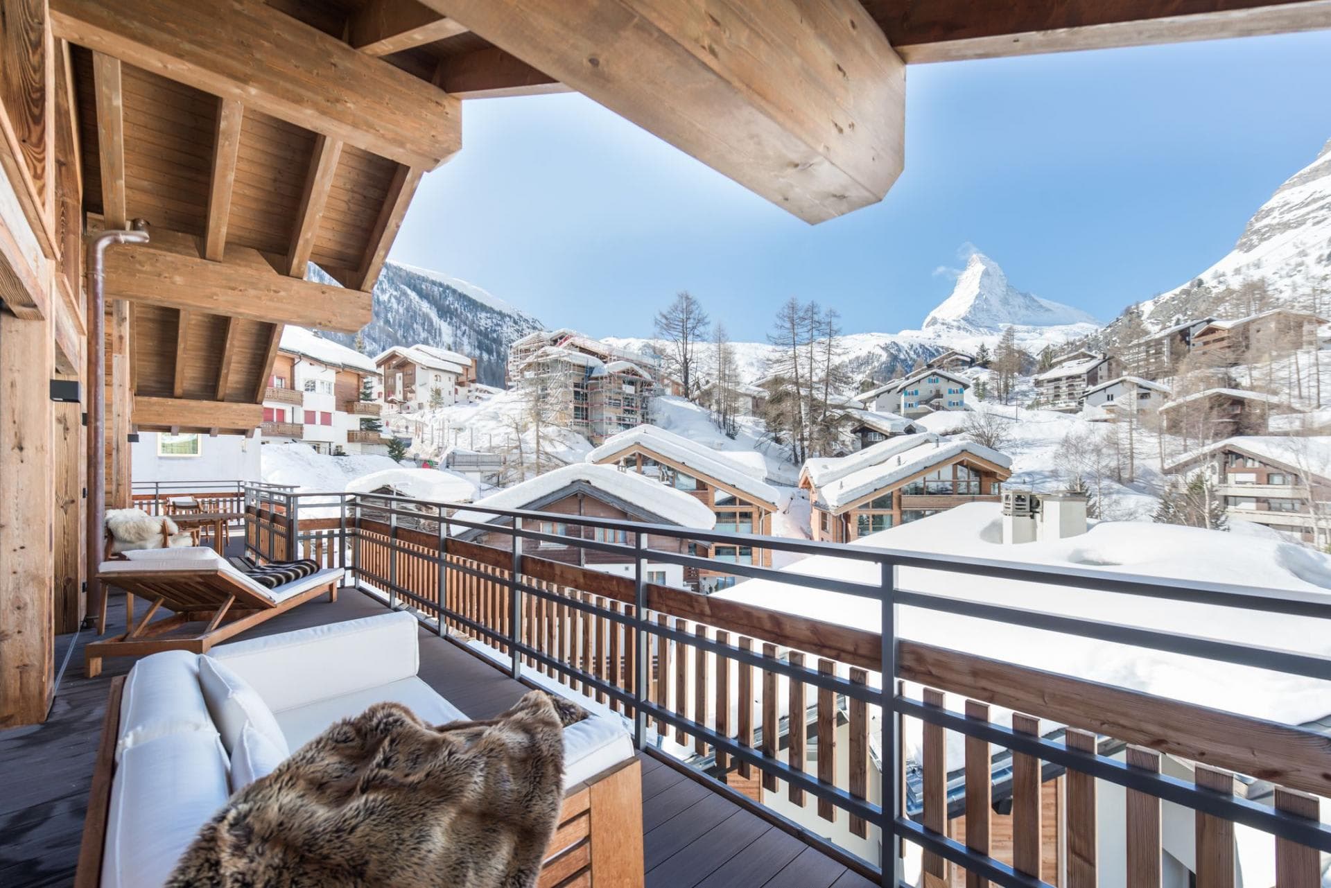 Covered balcony with lounge seating and Matterhorn mountain views