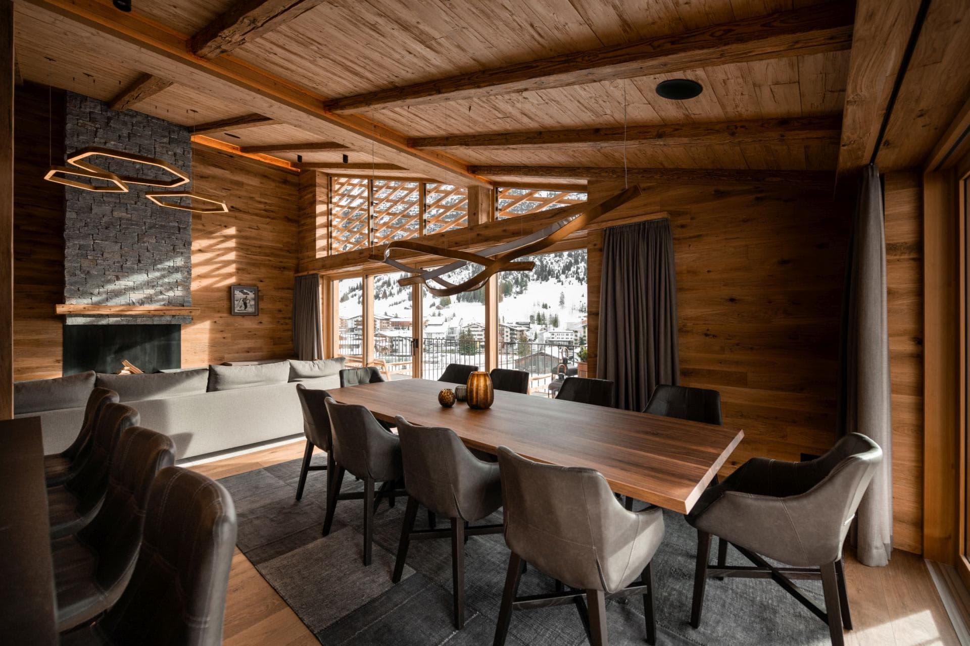 Dining area seats 10; features wood-paneled walls and ski village views