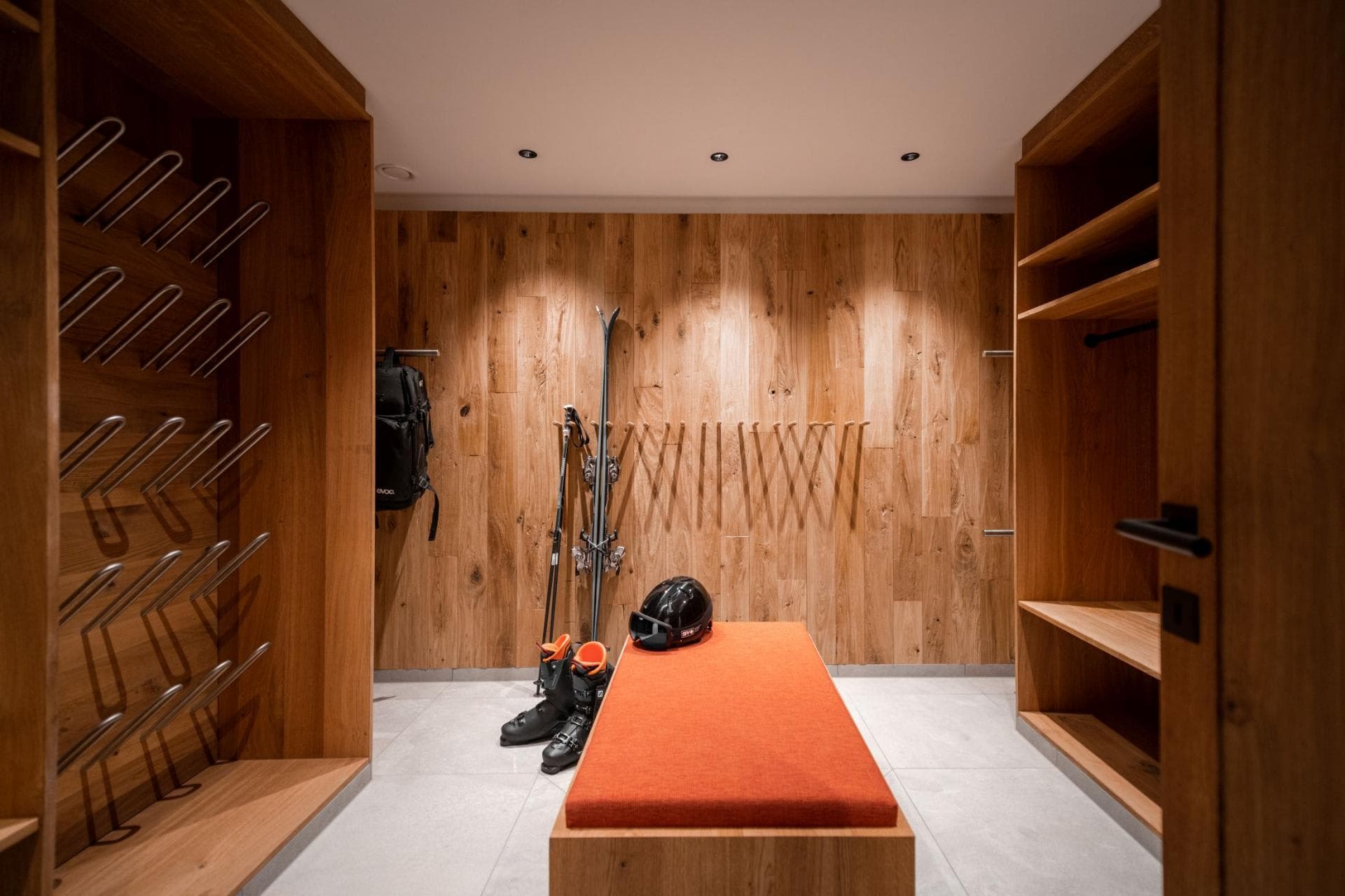 Ski boot room with heated boot dryers and bench seating