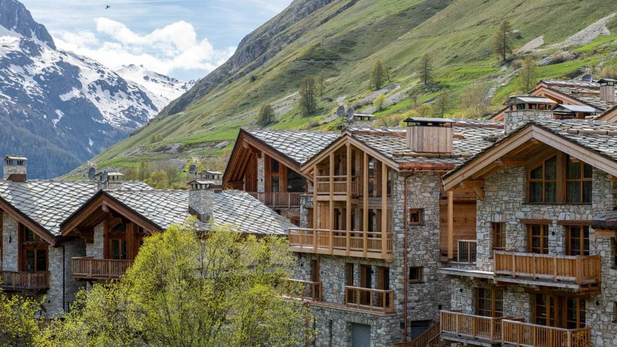 Stone and timber exterior with balconies overlooking the Alps