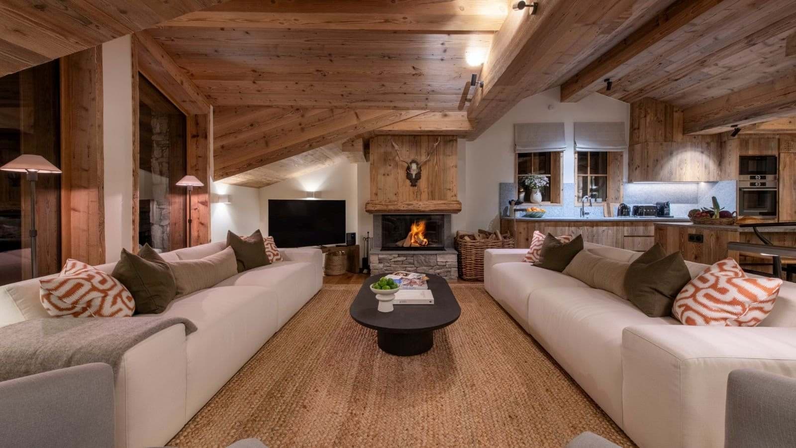 Open living area with wood-burning fireplace and seating for 8 guests