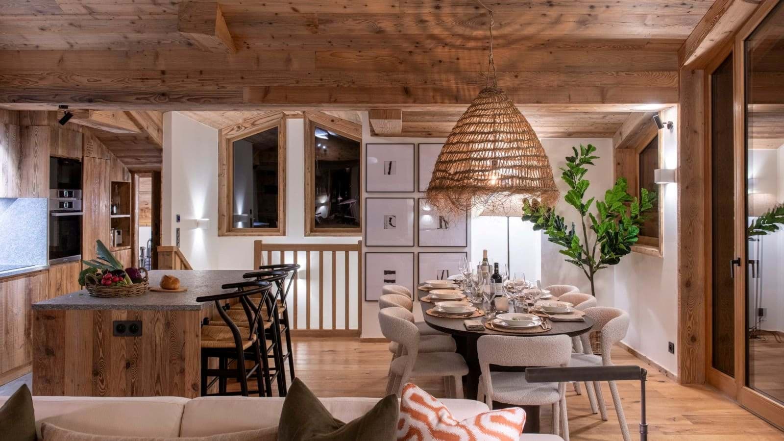 Open dining area with seating for 8 adjacent to kitchen island