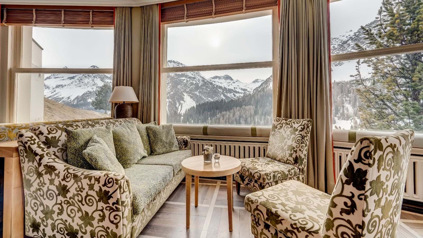 Sitting area with panoramic mountain views and blackout curtains