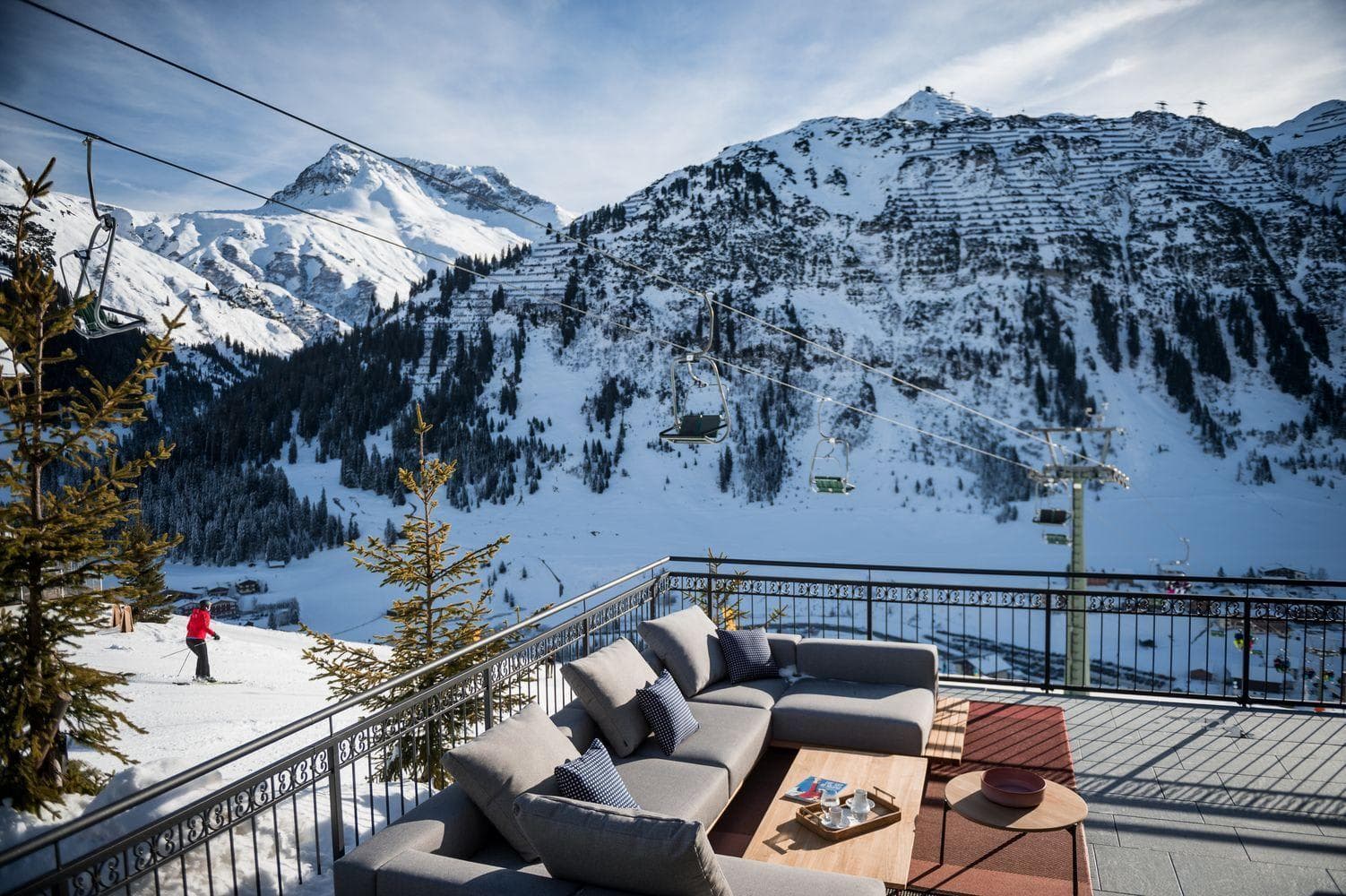Ski-in/ski-out terrace with sectional seating and chairlift views