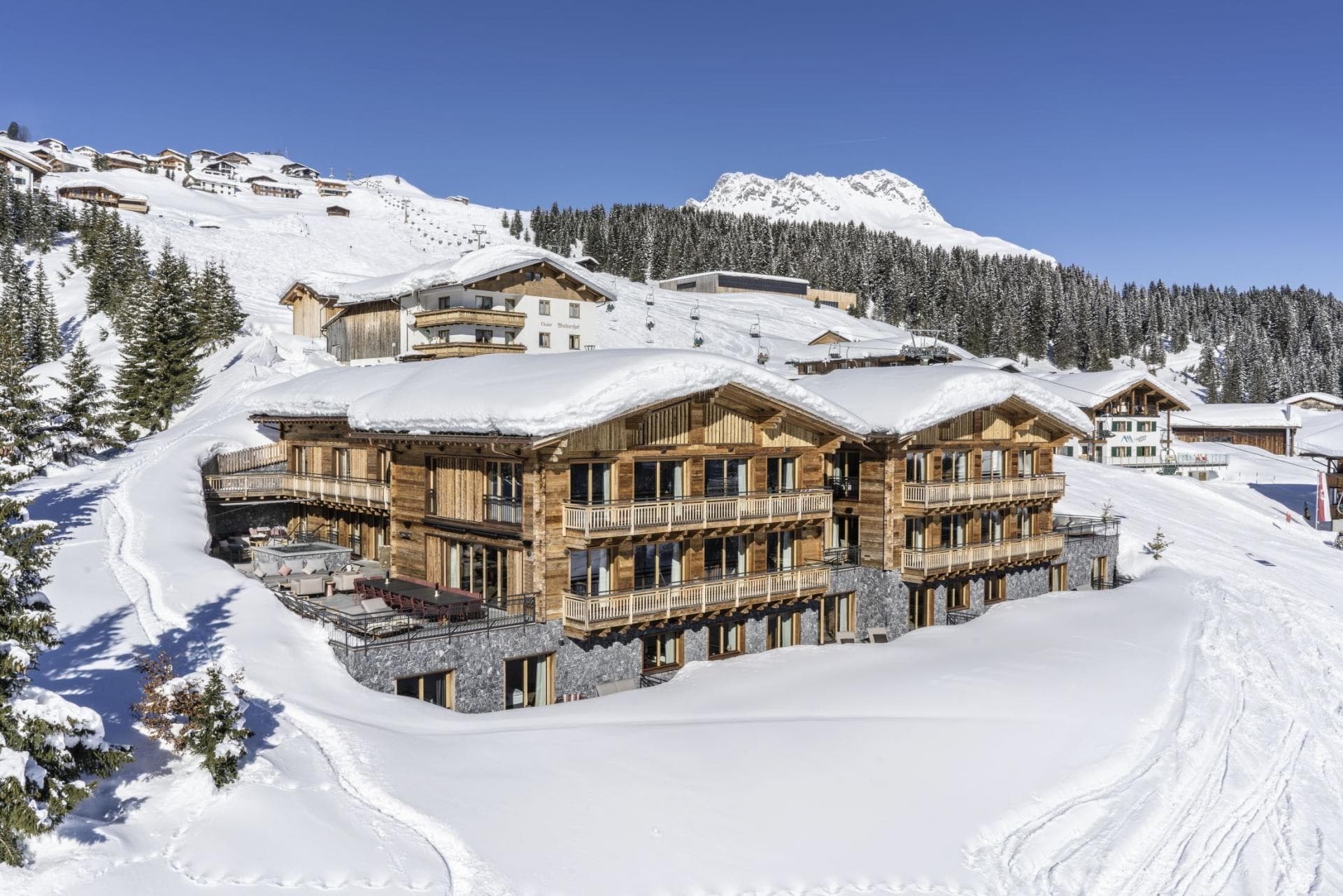 Ski-in, ski-out timber chalet with wrap-around balconies and private hot tub