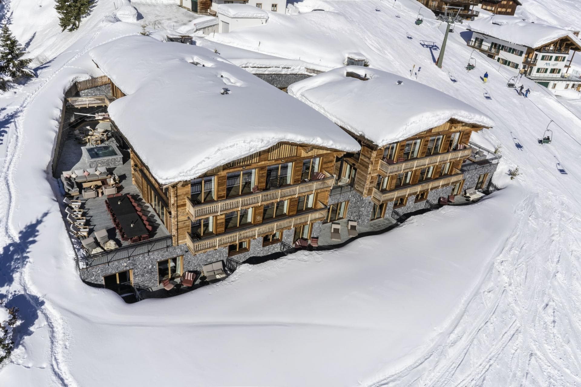 Ski-in/ski-out chalet with outdoor terrace, hot tub, and dining for 12