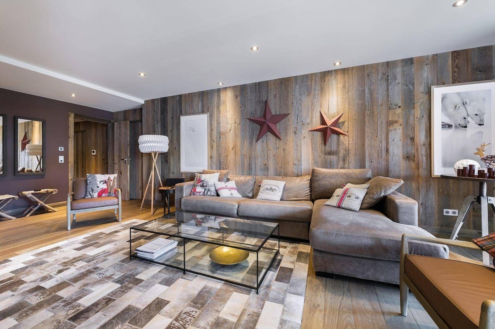 Living area with sectional seating and reclaimed wood feature wall