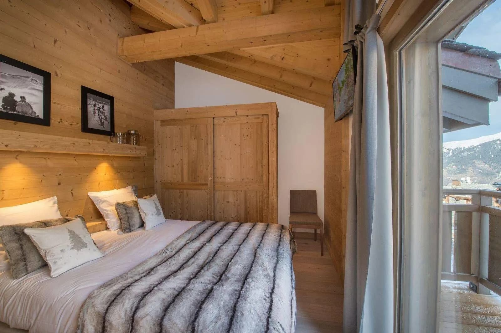 Double bedroom with timber wall and built-in storage