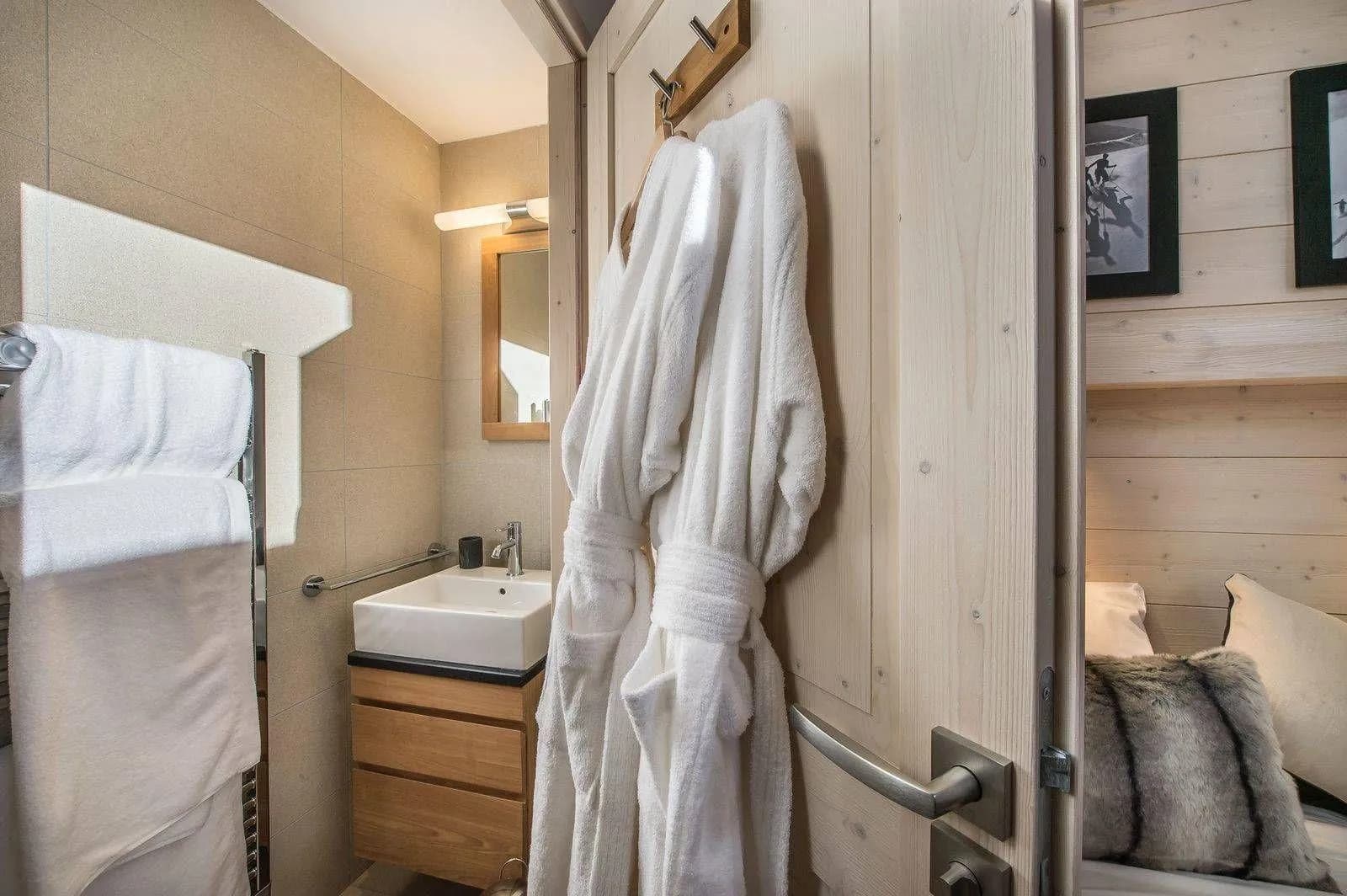 Shower room with a basin and heated towel rail