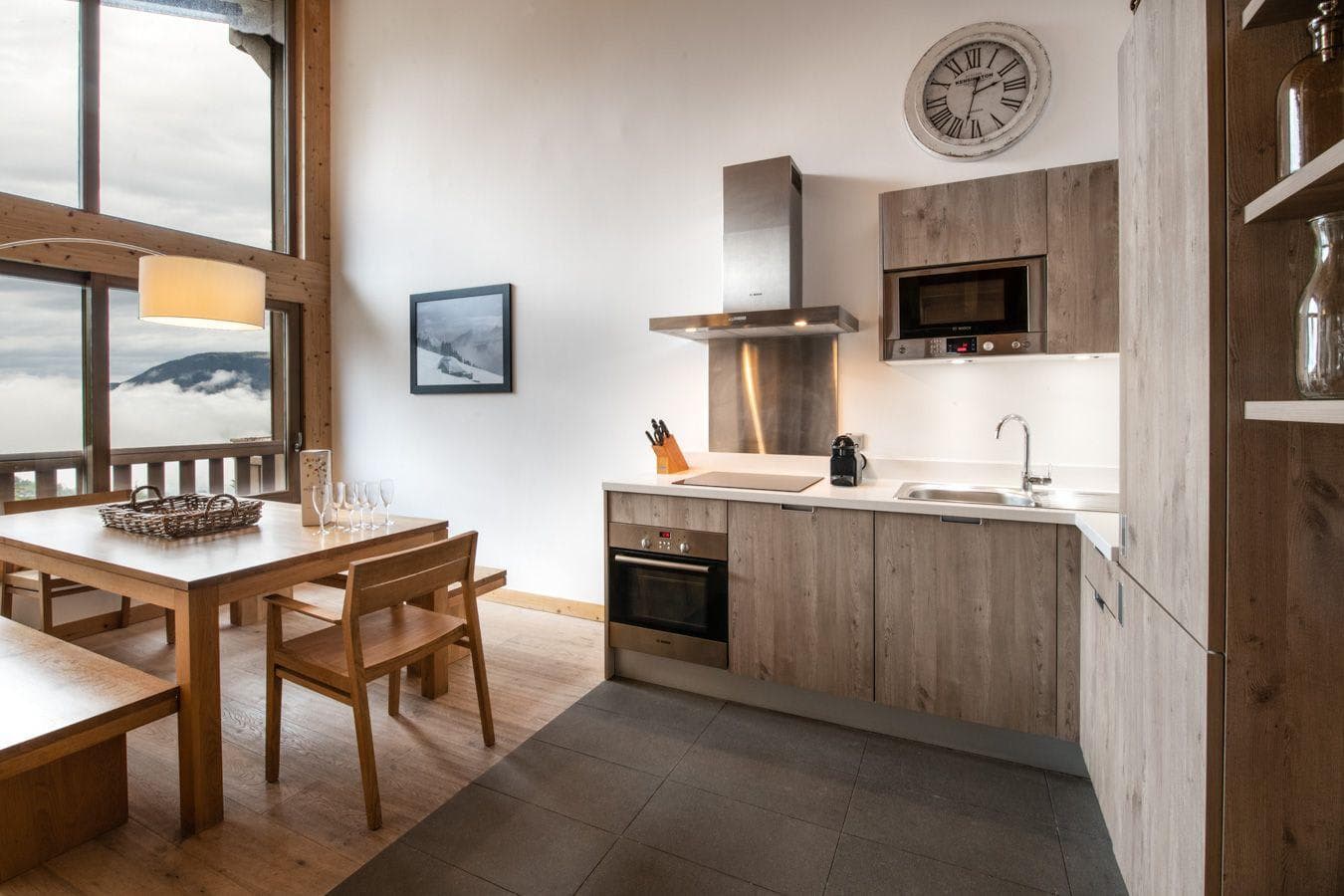 Kitchen with Bosch appliances and dining area with mountain views