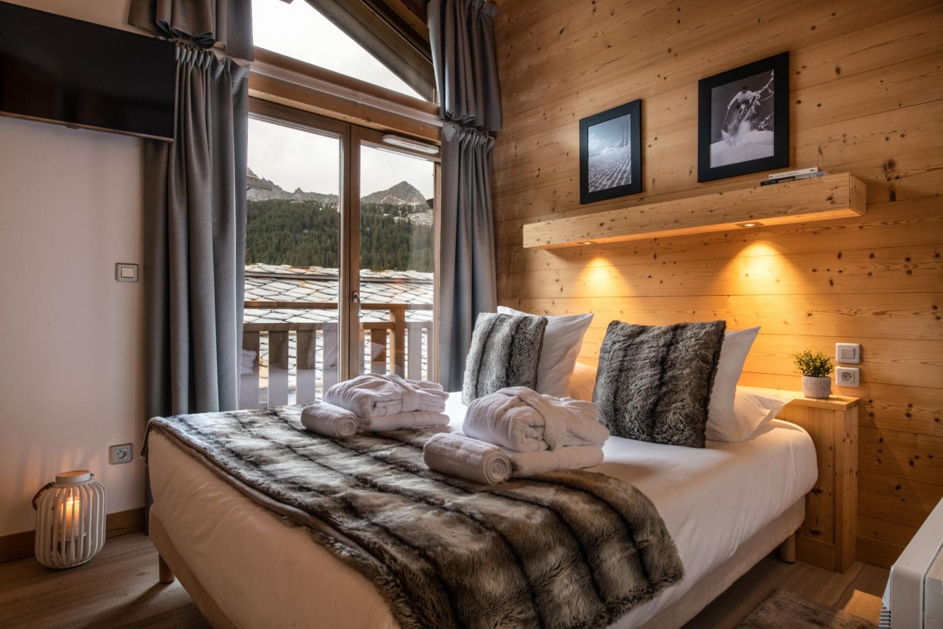Bedroom with king bed and balcony access to mountain views