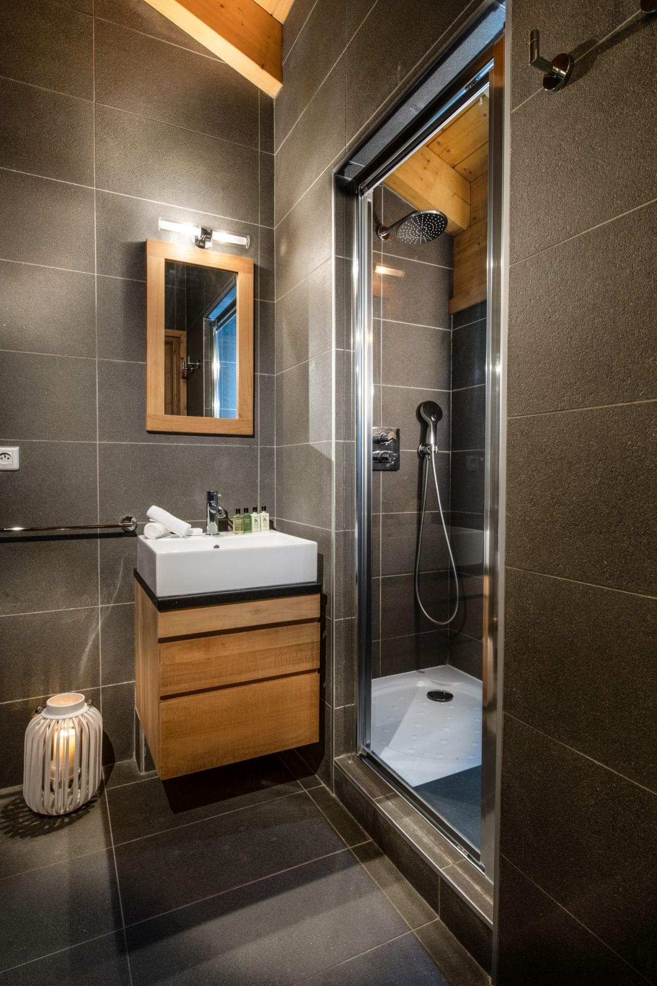 Bathroom with single vanity and walk-in shower with rainfall head