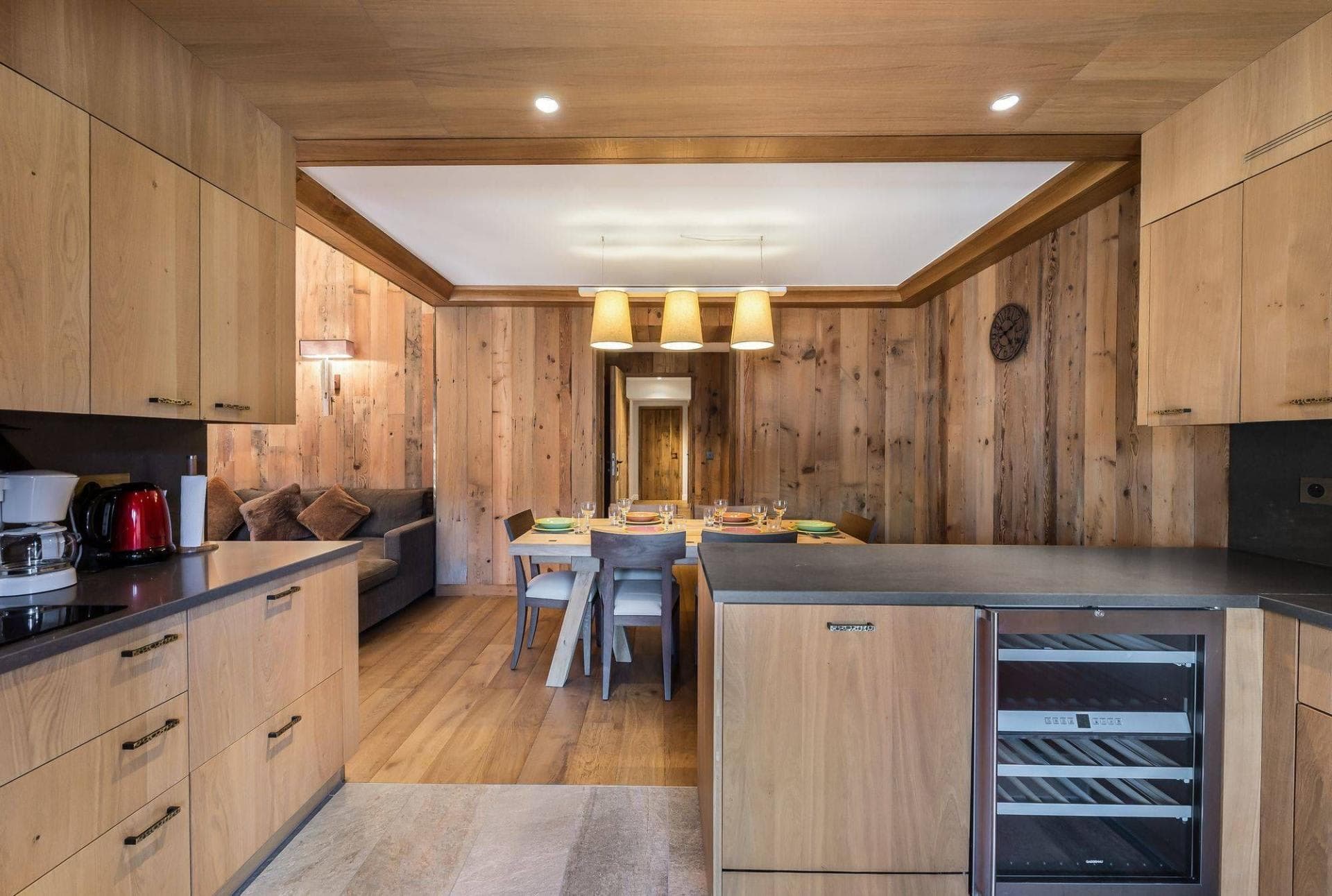 Kitchen and dining area with built-in wine fridge and seating for 6