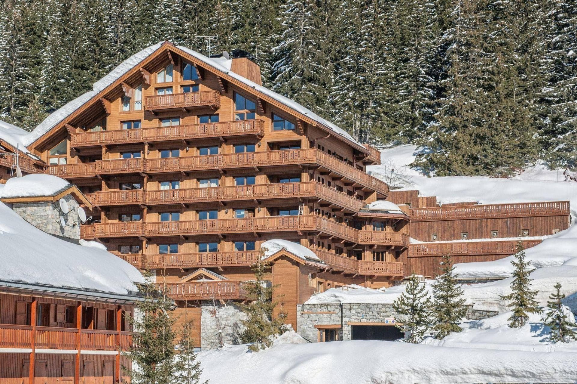 Ski-in/ski-out chalet exterior with private balconies and mountain views
