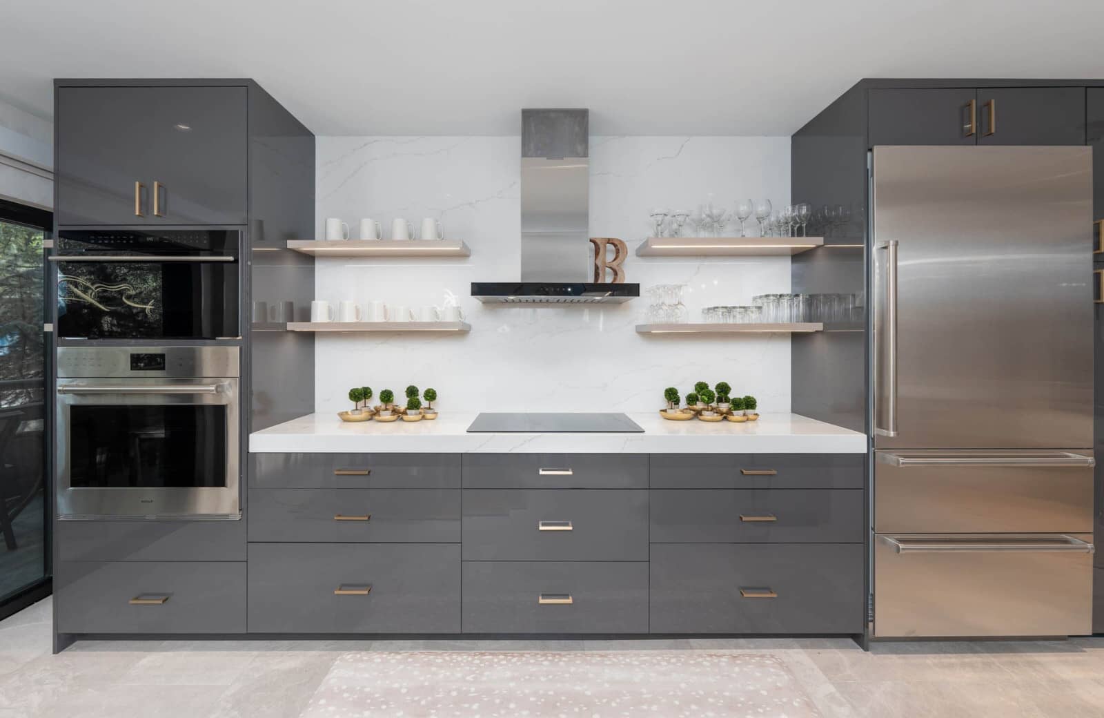 Kitchen with induction cooktop and built-in wall oven