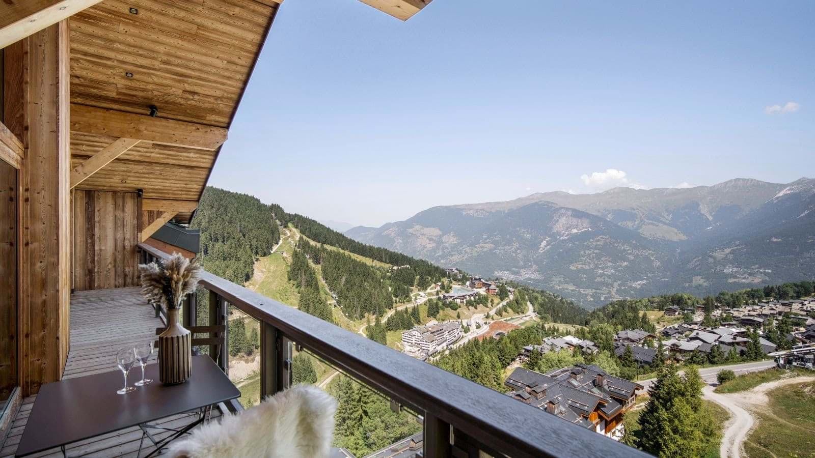 Covered balcony with valley views overlooking the village and ski runs