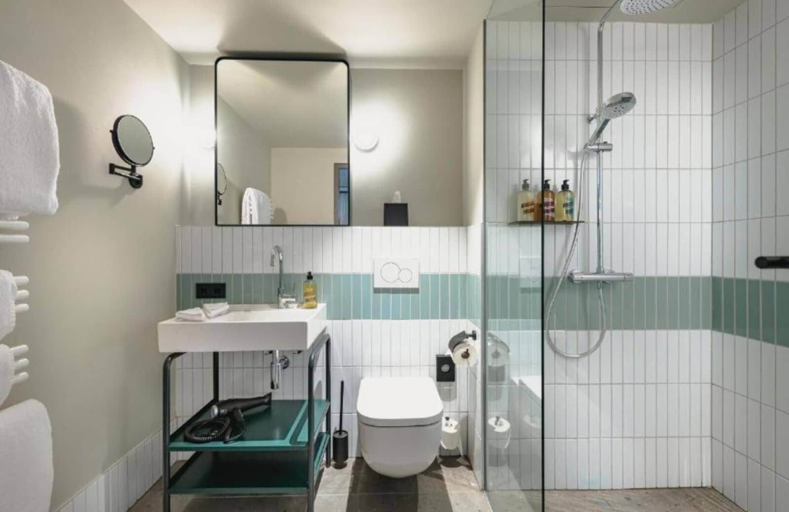 Bathroom with walk-in rainfall shower and heated towel rack