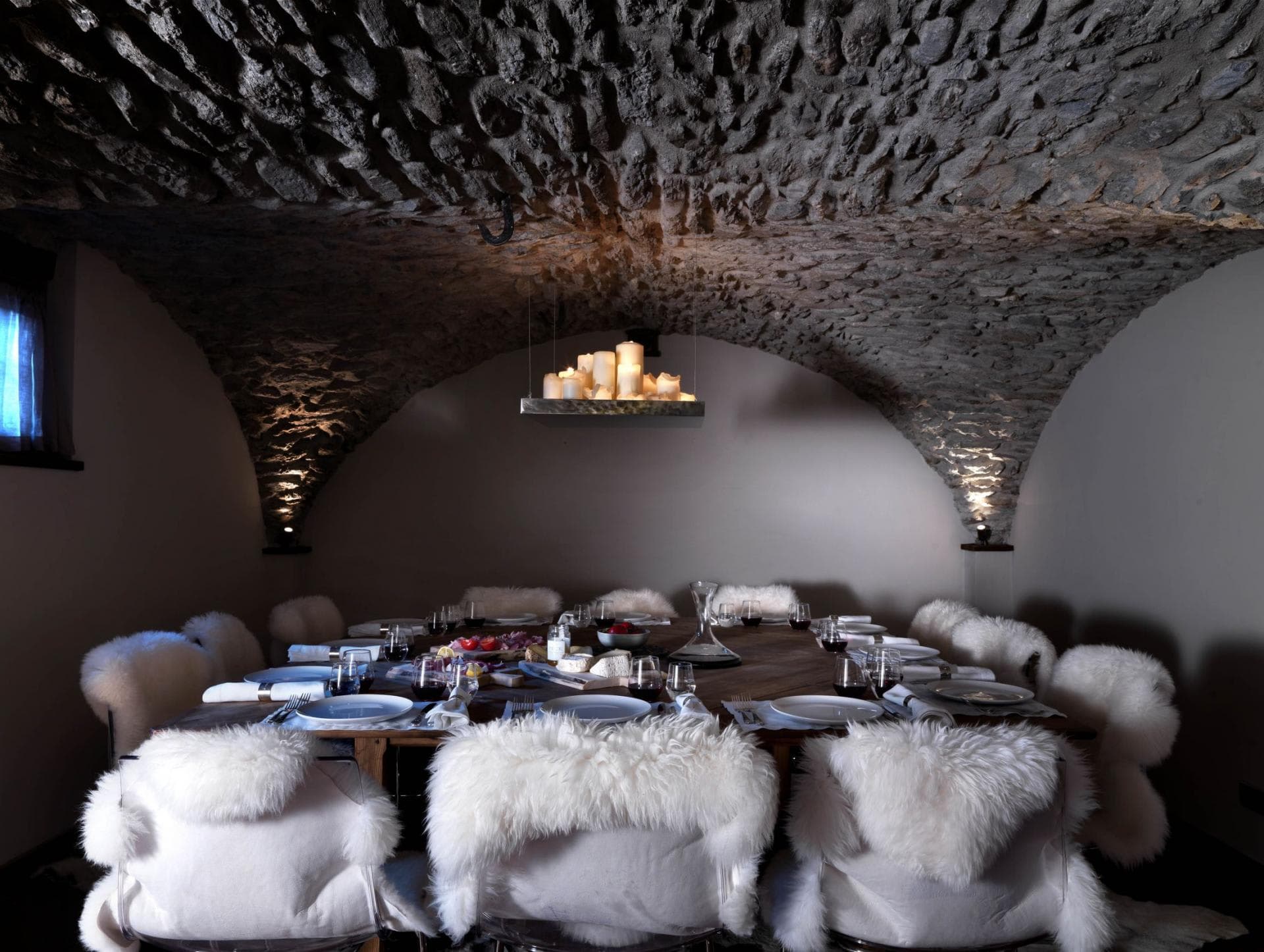 Wine cellar dining room with vaulted stone ceiling and seating for 12