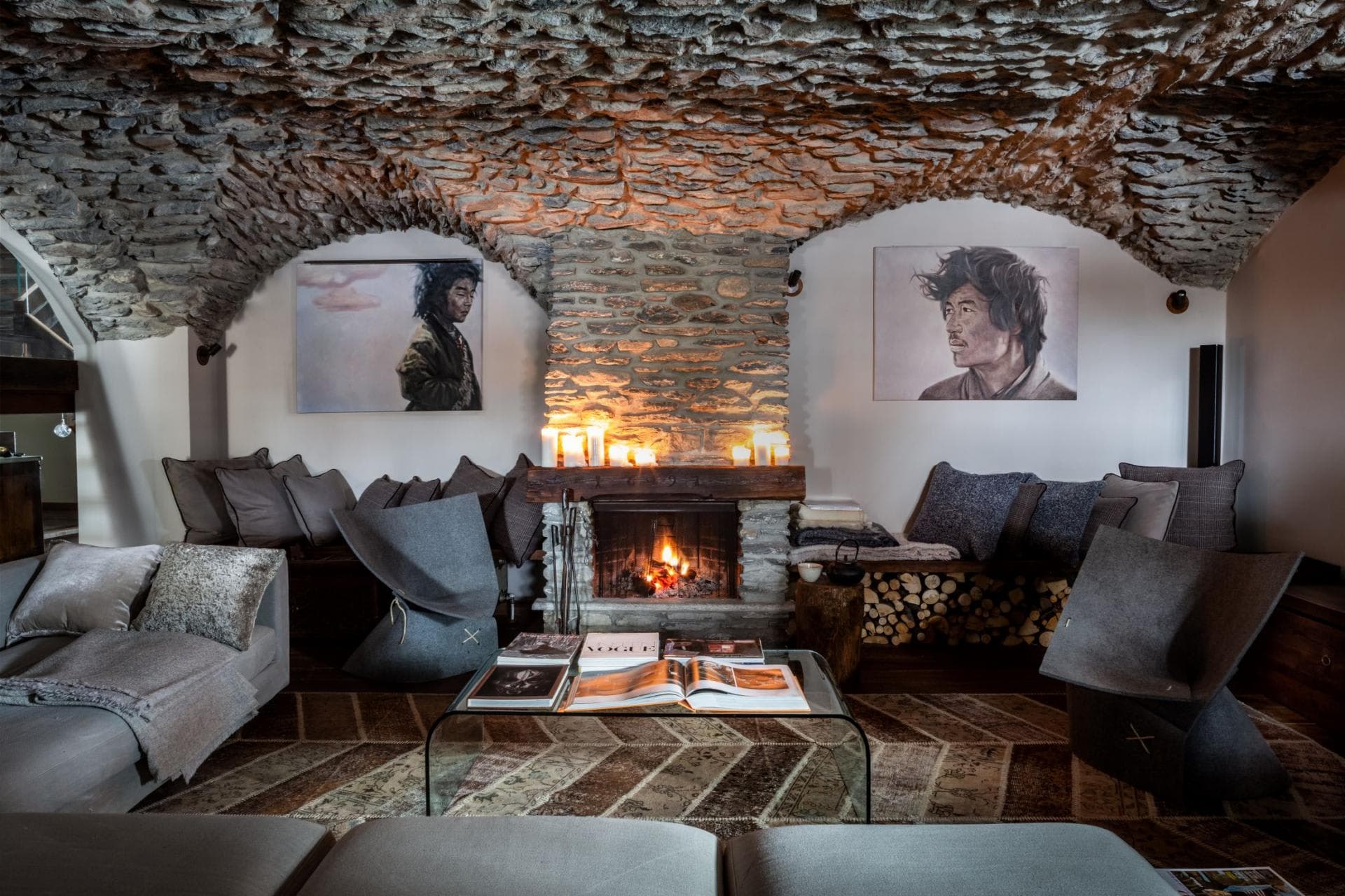 Stone-vaulted lounge with wood-burning fireplace and bench seating