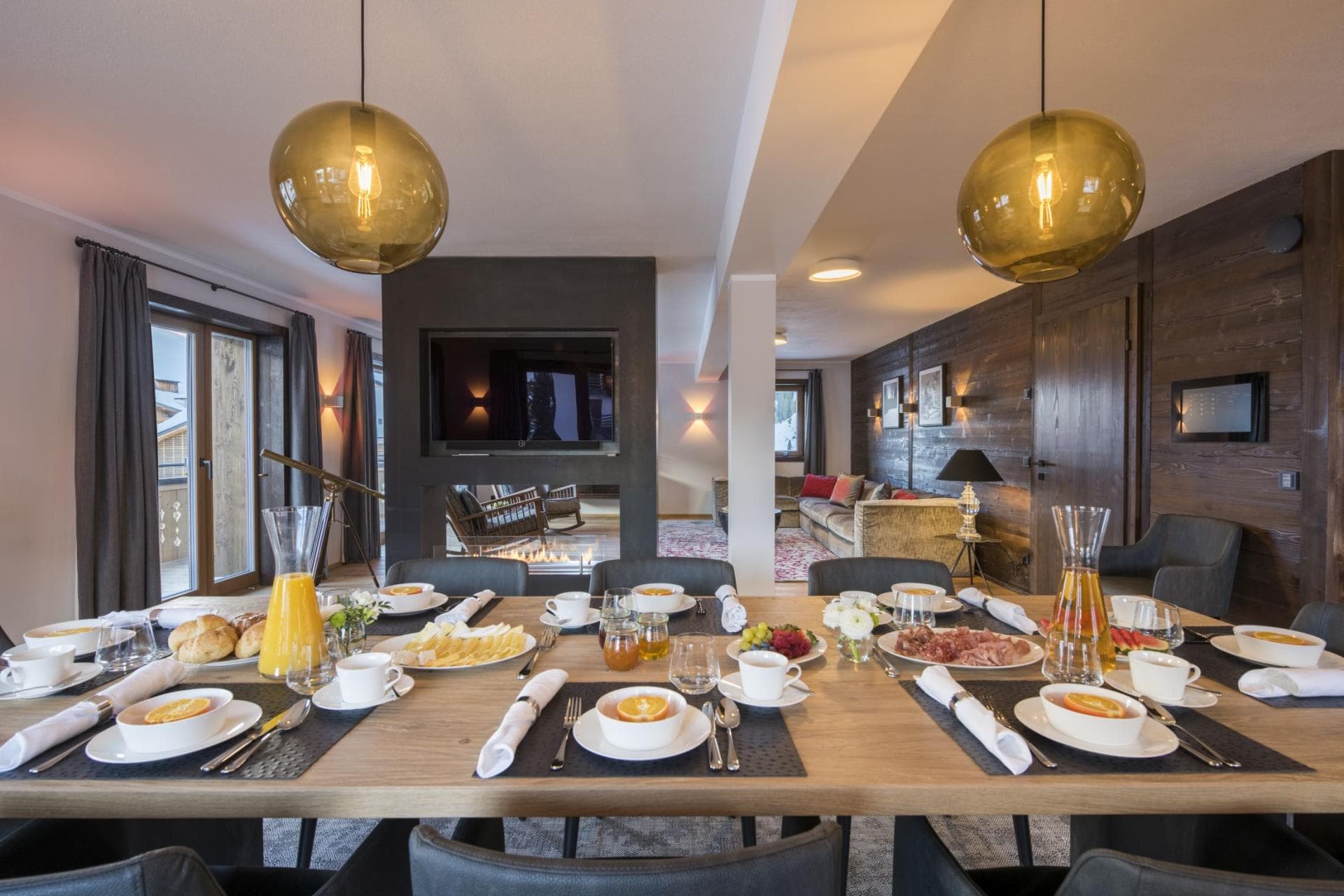 Dining area with double-sided fireplace and terrace access