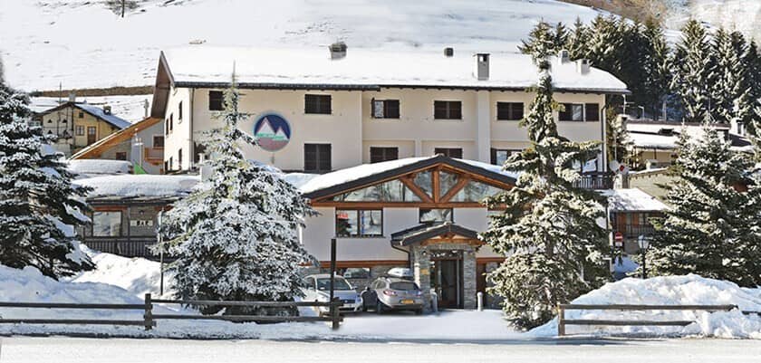 Ski-in/ski-out chalet exterior with private driveway parking