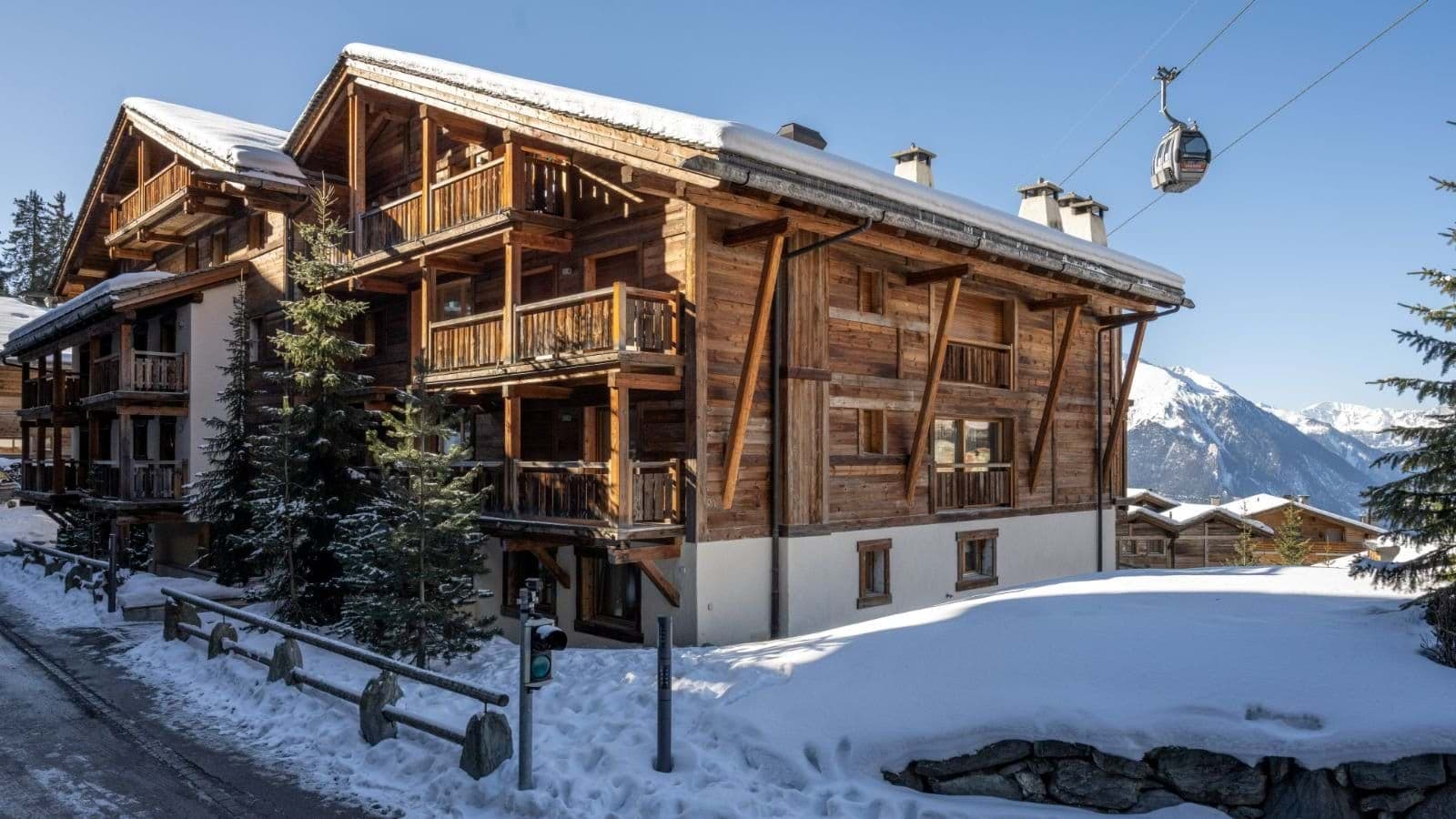 Ski-in/ski-out chalet exterior located directly under the Medran gondola line