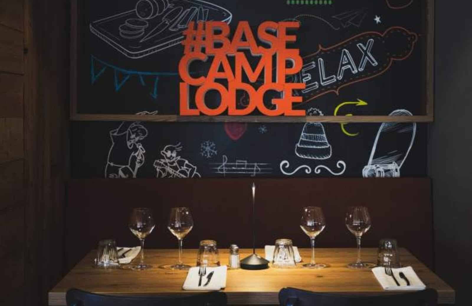 Dining area with booth seating and custom chalkboard wall art