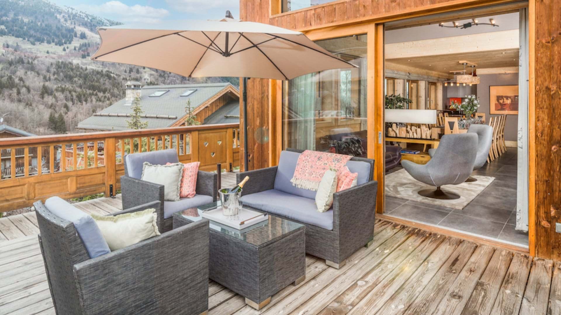 Private deck with lounge seating and valley mountain views