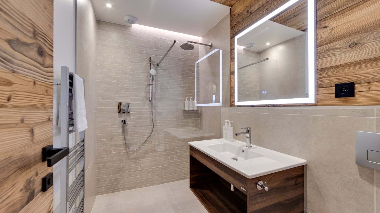 Bathroom with walk-in rainfall shower and heated towel rail