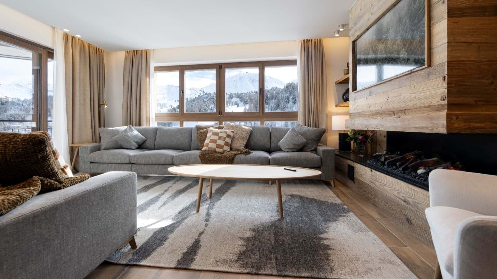 Living room with linear fireplace and mountain views; sectional seats 5