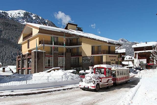 Hotel Bellevue exterior with private balconies and mountain shuttle access
