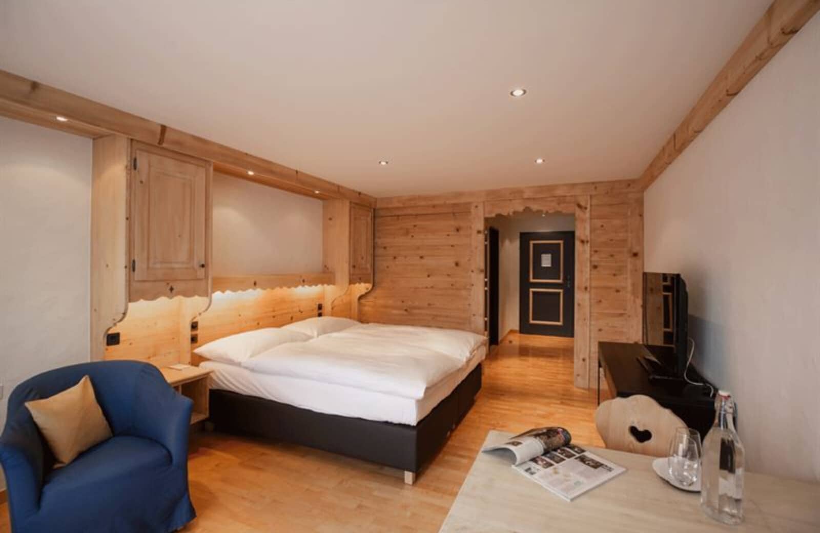 Primary bedroom with king bed and built-in pine cabinetry