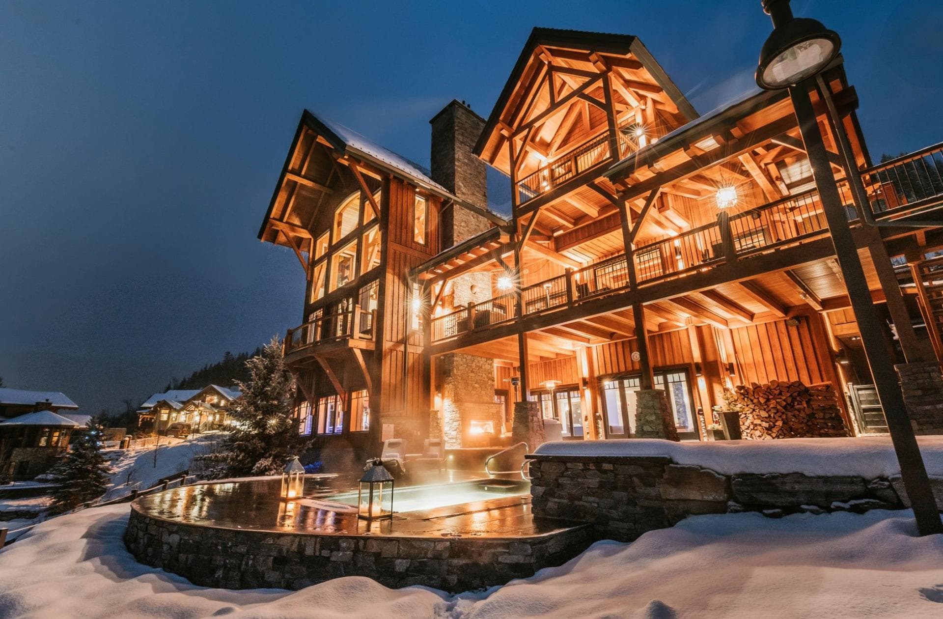Chalet exterior with heated pool and multiple covered balconies