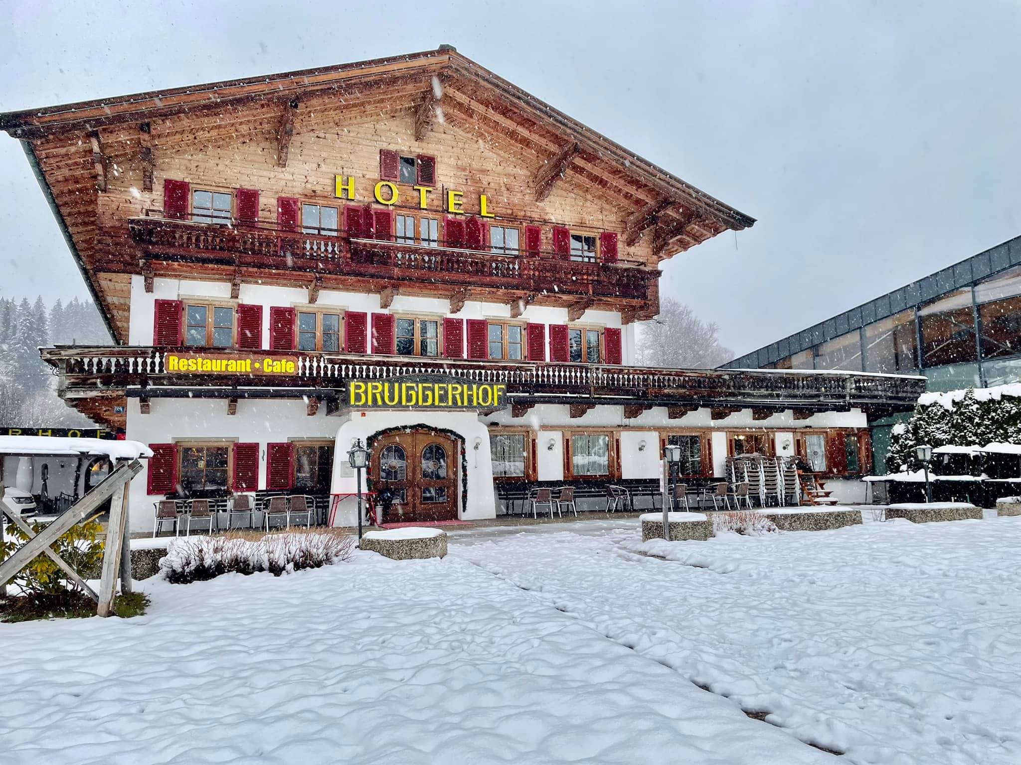 Chalet exterior with on-site restaurant and outdoor patio seating