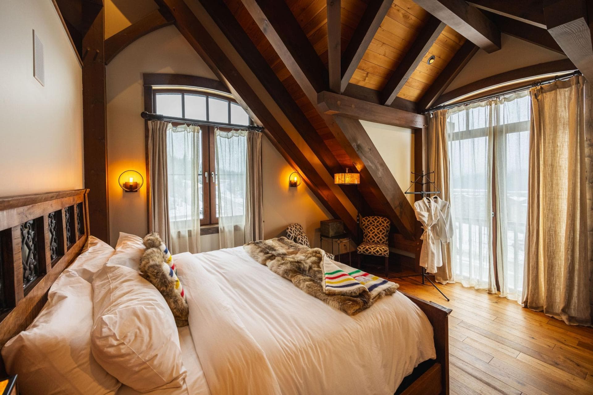 Primary bedroom with king bed and private balcony access