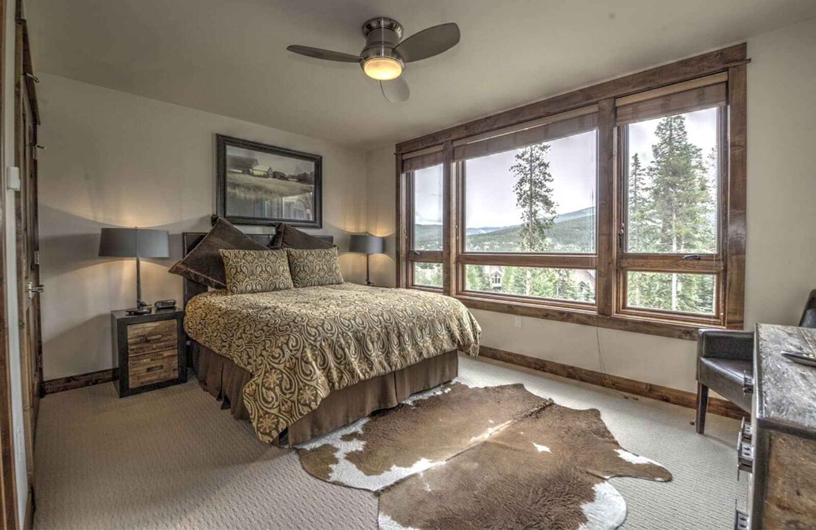 Guest bedroom with queen bed and mountain valley views