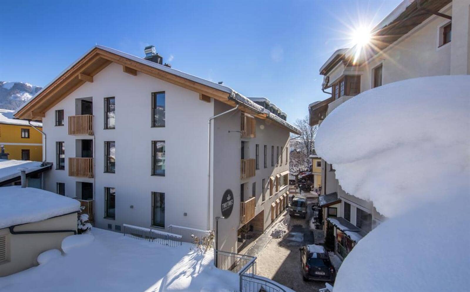 Alpine exterior with private balconies and central village access
