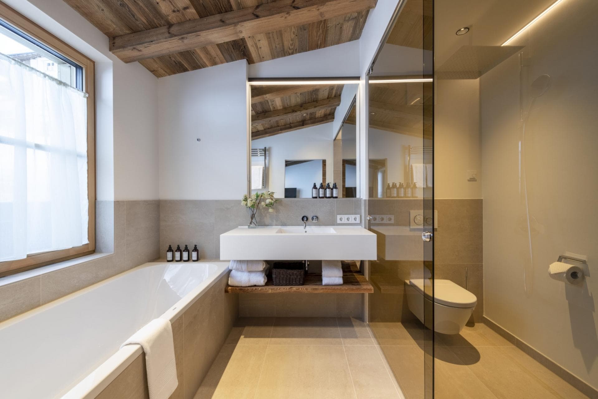Primary bathroom with heated floors, dual vanity, and walk-in shower