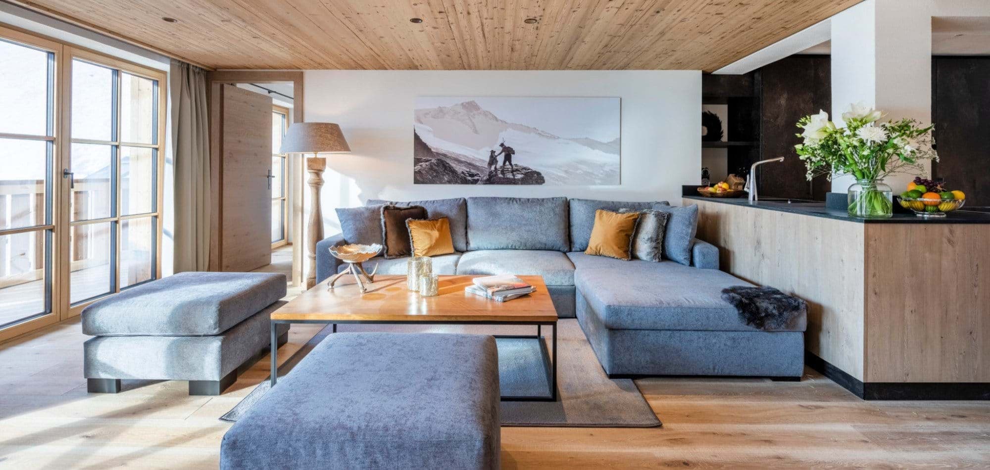 Living room with sectional seating for 7 and balcony access