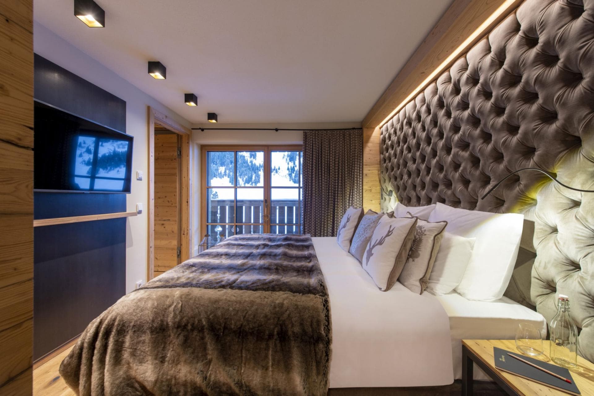 Primary bedroom with king bed and private balcony access