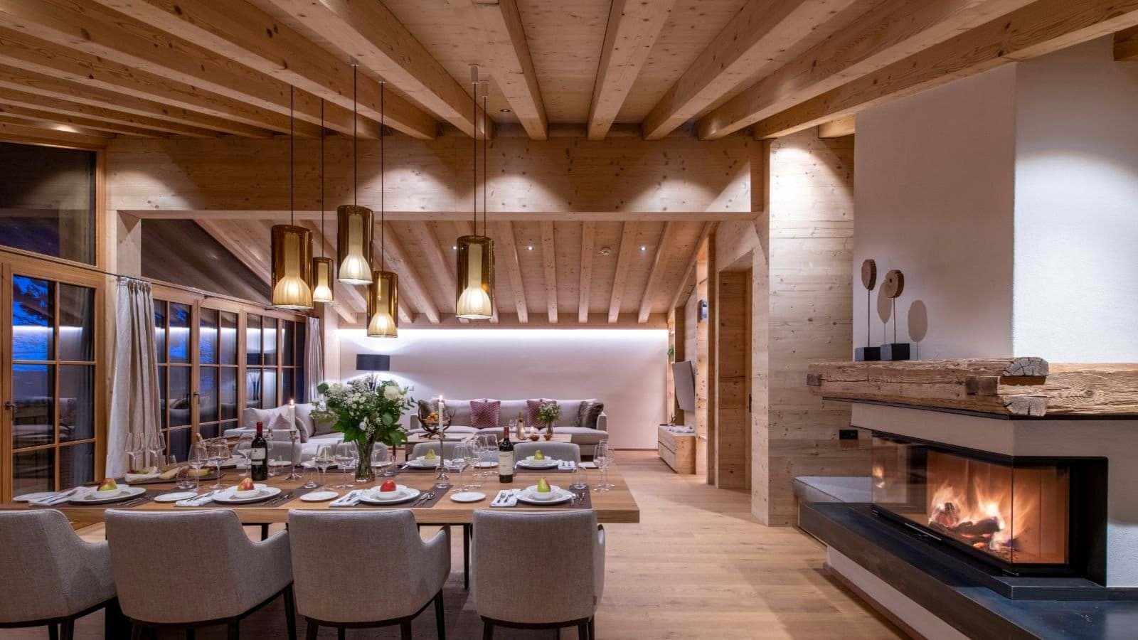 Open-plan dining area and living room with wood-burning fireplace