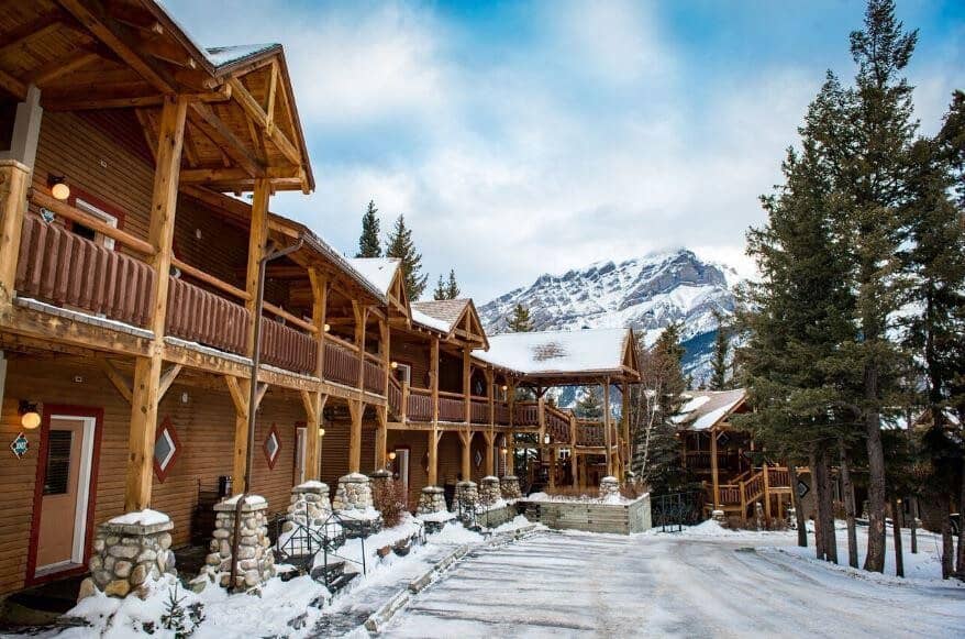 Timber lodge exterior with private balconies and mountain views