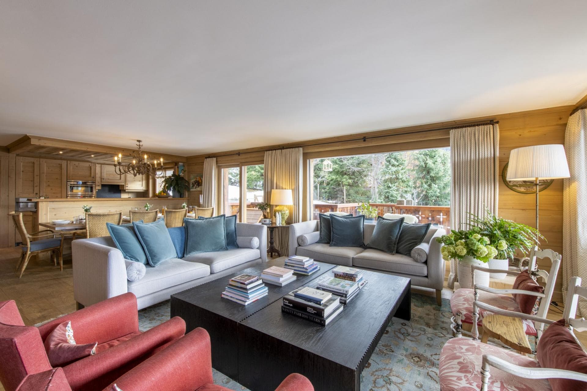 Open-plan living area with forest views and terrace access