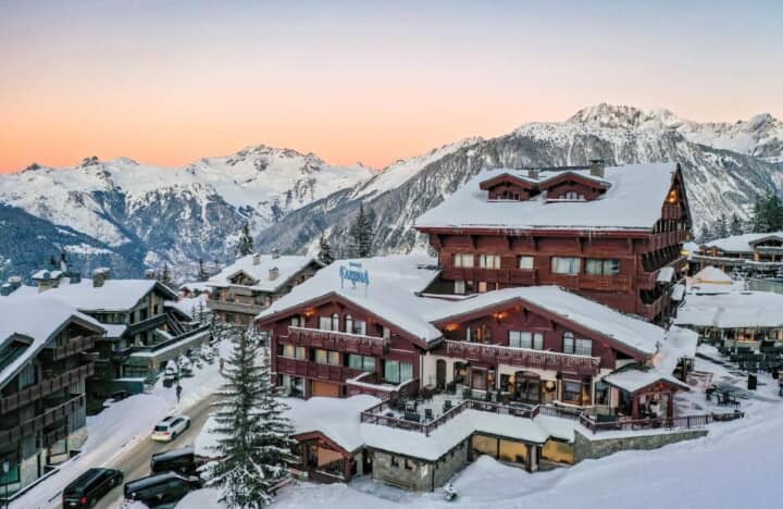 Ski chalet exterior featuring private balconies and panoramic alpine mountain views