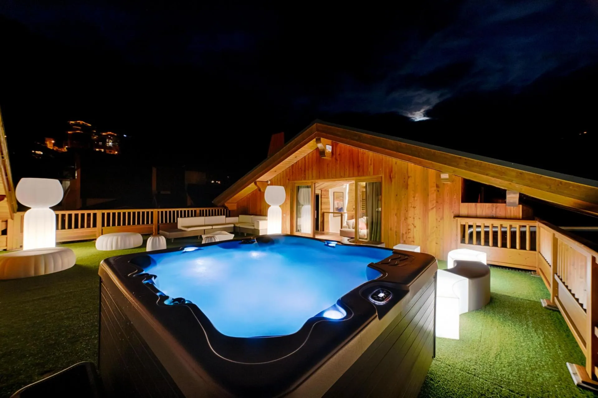 Private terrace with 6-person hot tub and illuminated lounge seating