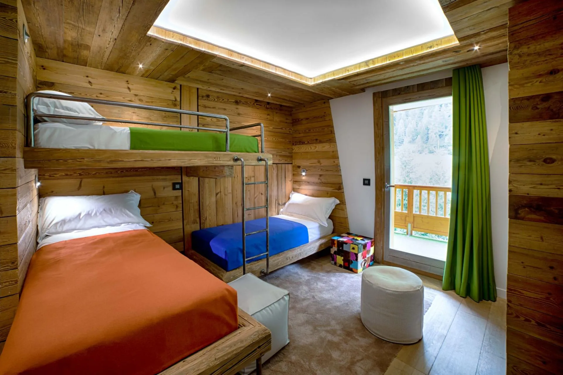 Bunk bedroom with three single beds and balcony access