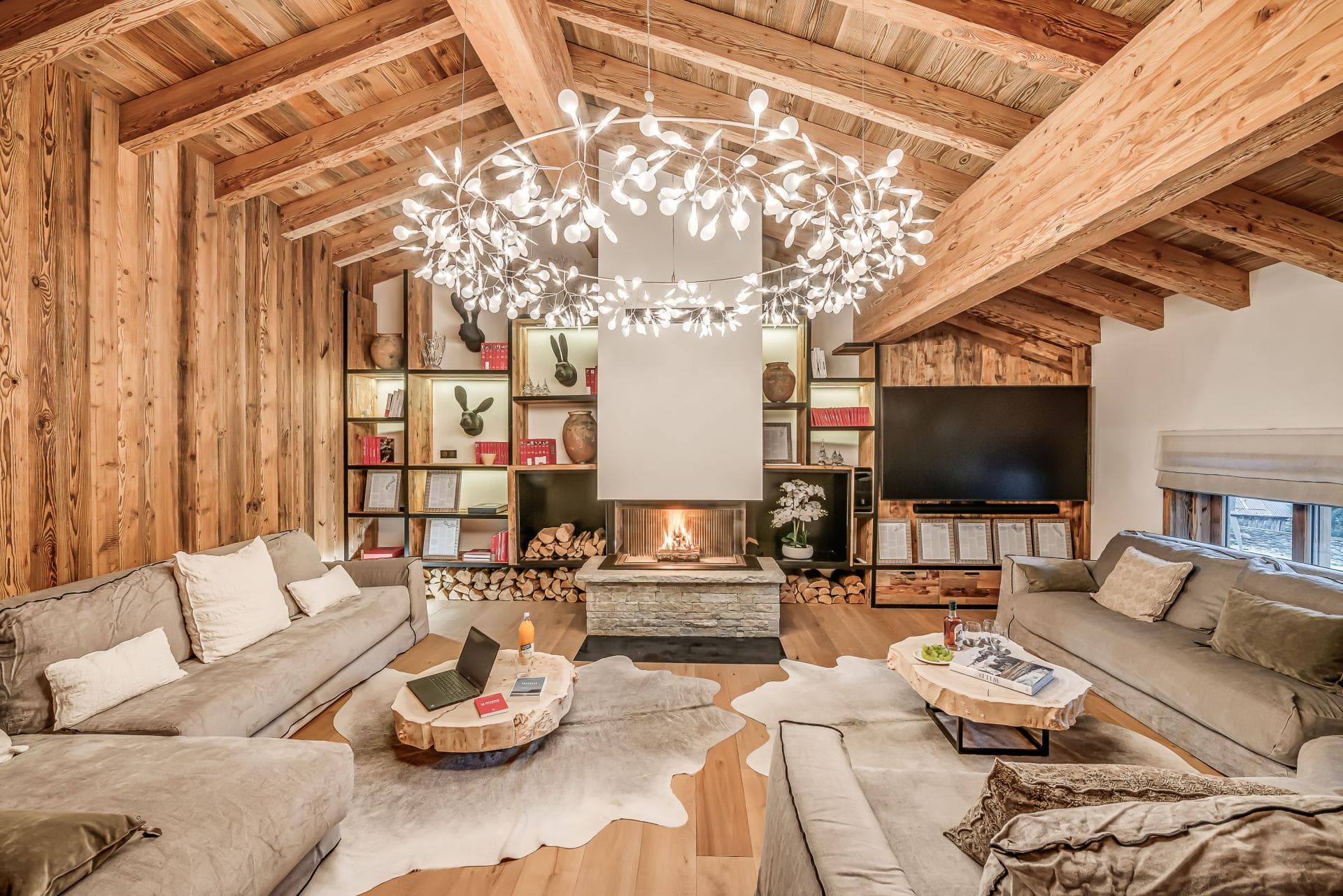 Living area with wood-burning fireplace and sectional seating for 10