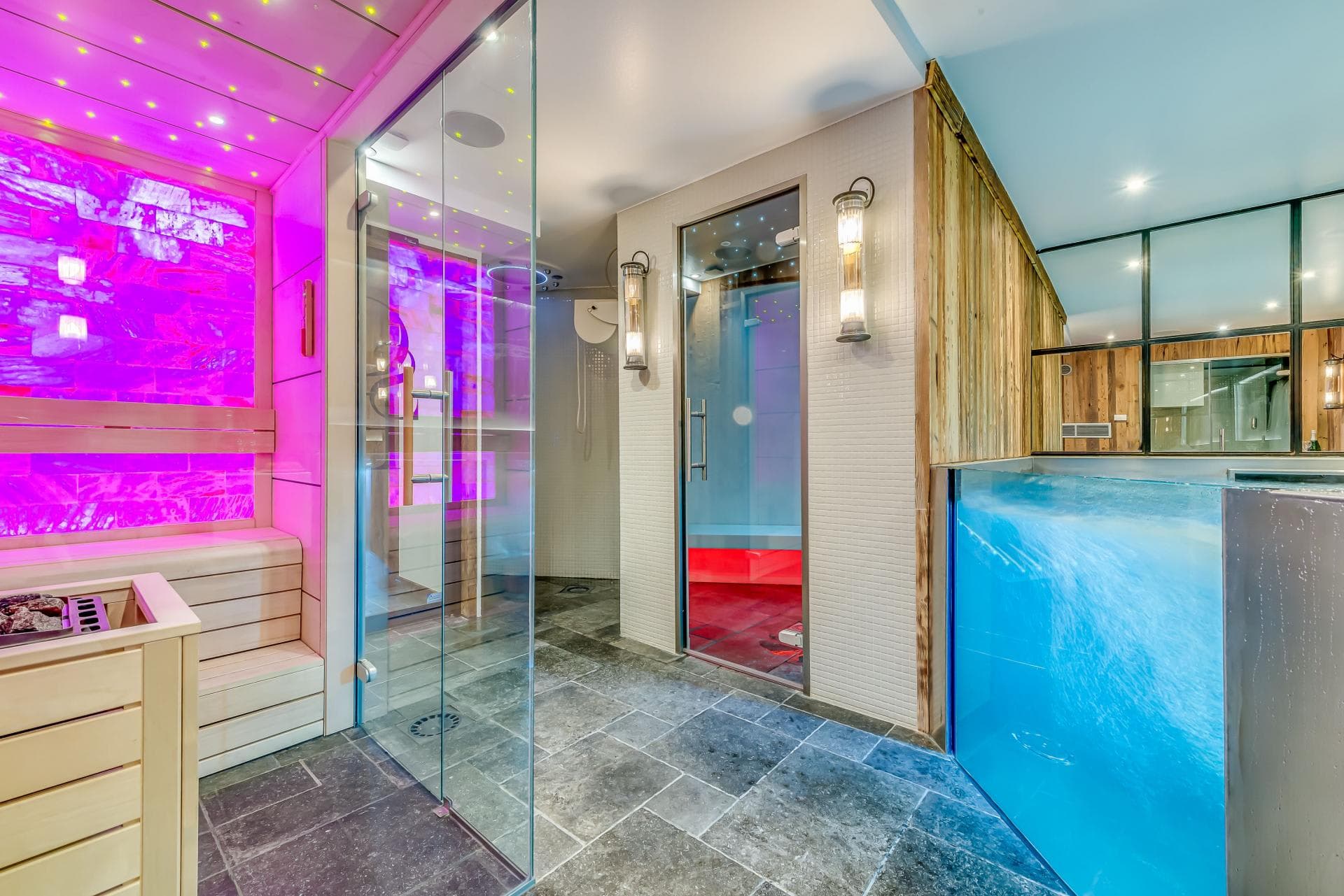 Spa area with dry sauna, steam room, and glass-walled plunge pool