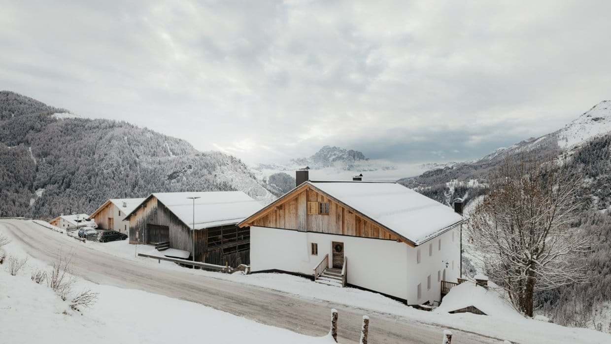 Chalet exterior with roadside access and panoramic mountain views